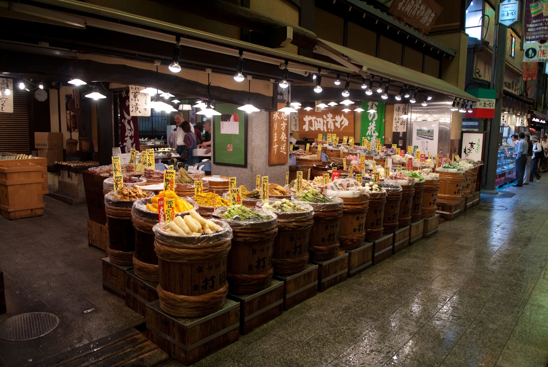 A tsukemono pickle shop in Nishiki Market, Kyoto, with barrels of pickles