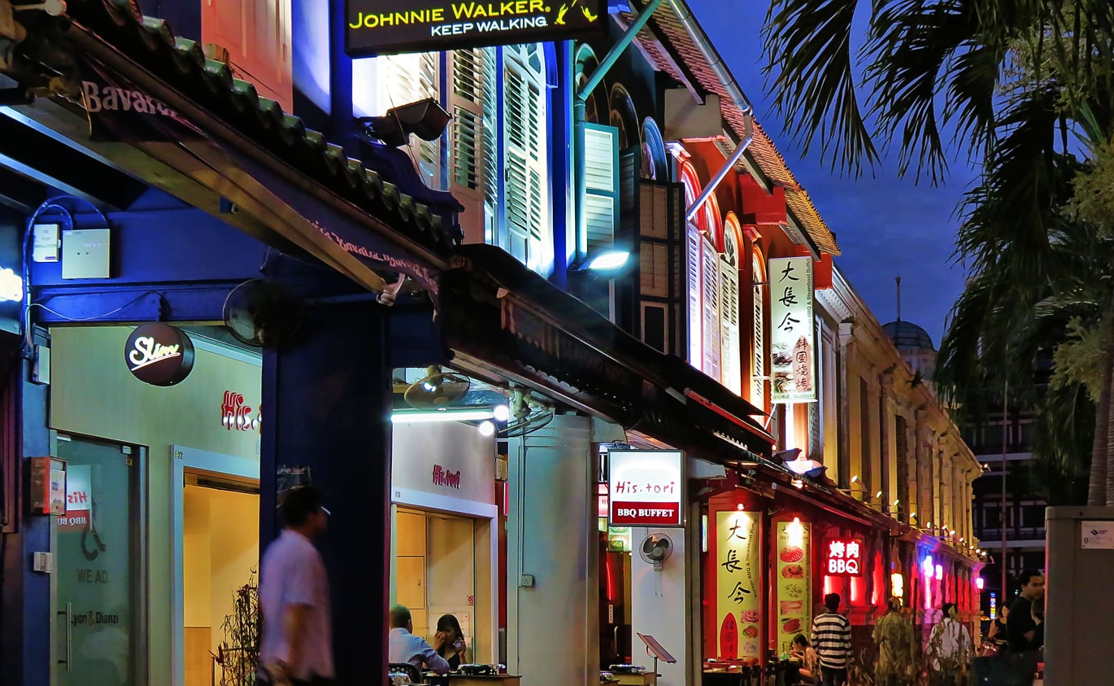 Colourful shophouses with Korean BBQ restaurants along Tanjong Pagar Road in Singapore at dusk