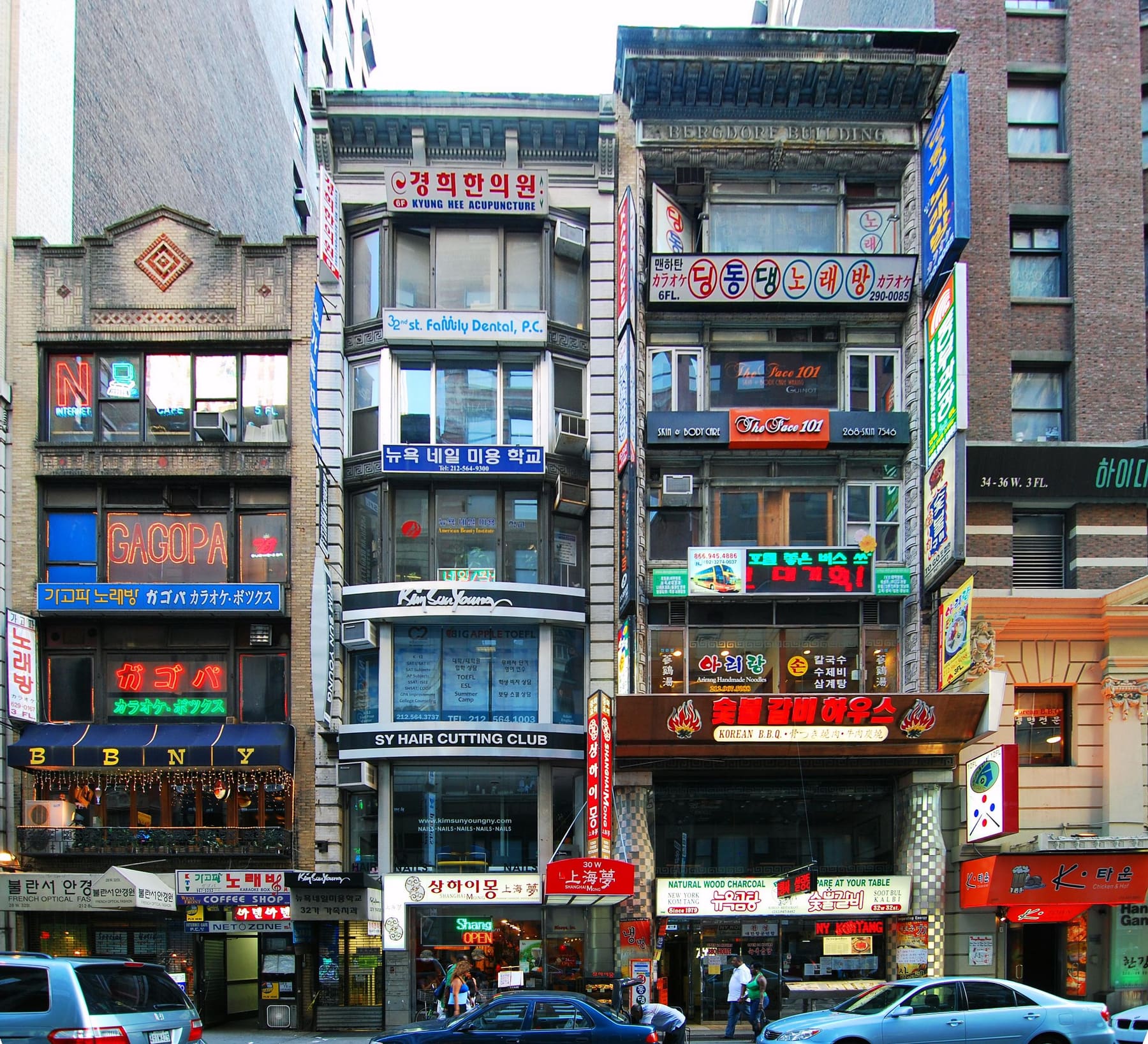 Shopfronts in Koreatown, Manhattan on West 32nd Street, crowded with Korean signs
